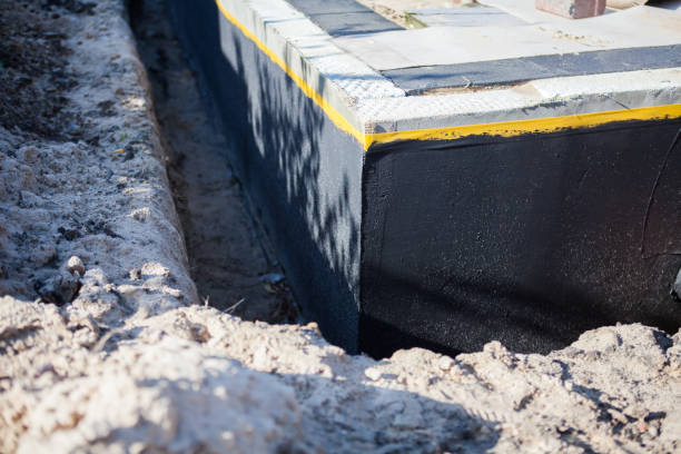 Professional Waterproofing technician working in Wellington, KS